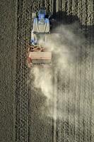 Aerial view of a tractor in the moment of sowing photo