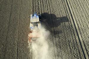 Aerial view of a tractor in the moment of sowing photo