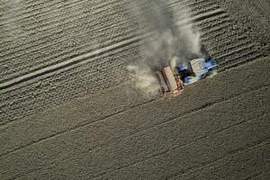 Aerial view of a tractor in the moment of sowing photo