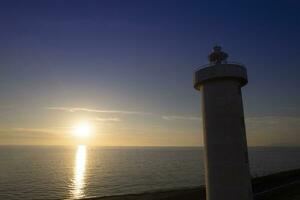 Aerial view of the lighthouse of Viareggio Tuscany taken at sunset photo