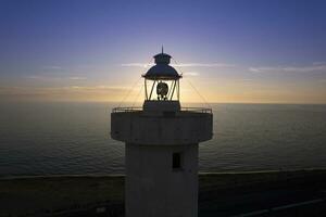 Aerial view of the lighthouse of Viareggio Tuscany taken at sunset photo