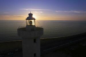 Aerial view of the lighthouse of Viareggio Tuscany taken at sunset photo