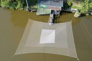 Aerial photograph of old fishing post with net photo