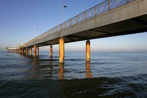 View at dawn of Marina di Pietrasanta pier Tuscany Italy photo