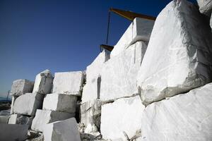 Storage of freshly extracted blocks of white statuary marble photo