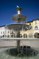 Public fountain in the square of Colle Val D'Elsa Tuscany Italy photo