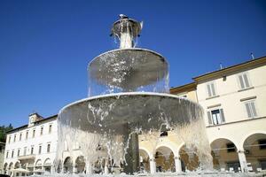 Public fountain in the square of Colle Val D'Elsa Tuscany Italy photo