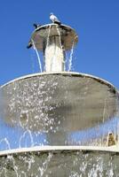 Public fountain in the square of Colle Val D'Elsa Tuscany Italy photo