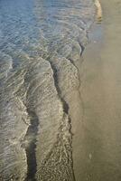 The shape and the transparency of the sea waves photo