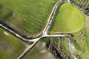 Aerial photography of a white road in Maremma photo