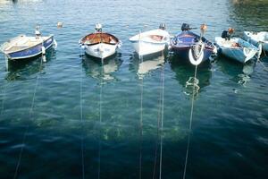 Small fishing boats moored in the harbour photo