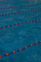 a blue swimming pool with orange and red lines photo