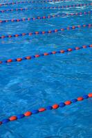 a blue swimming pool with orange and red lines photo