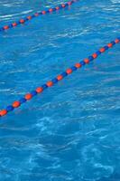 a blue swimming pool with orange and red lines photo