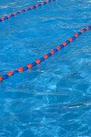 a blue swimming pool with orange and red lines photo