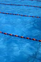 a blue swimming pool with orange and red lines photo