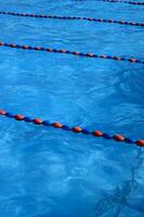 a blue swimming pool with orange and red lines photo