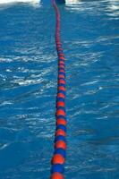 a blue swimming pool with orange and red lines photo