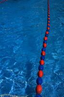 a blue swimming pool with orange and red lines photo