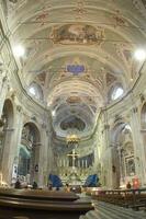 a church with a cross and a gold chandelier photo