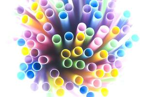 a bunch of colorful straws on a white background photo