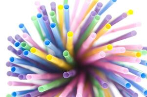 a bunch of colorful straws on a white background photo