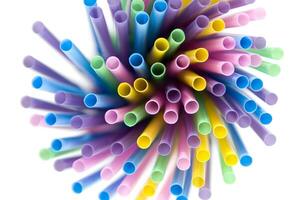 a bunch of colorful straws on a white background photo