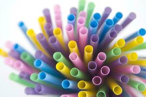 a bunch of colorful straws on a white background photo