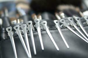 a black leather case with many brushes and other tools photo