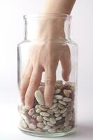 a jar of beans and a glass jar with beans photo