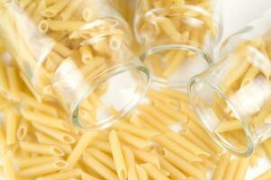 three glass jars filled with pasta photo