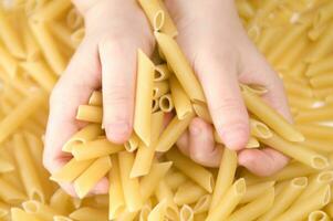 three glass jars filled with pasta photo