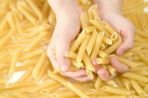 three glass jars filled with pasta photo