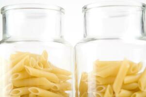 three glass jars filled with pasta photo