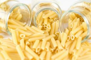 three glass jars filled with pasta photo