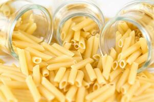 three glass jars filled with pasta photo