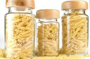 three glass jars filled with pasta photo