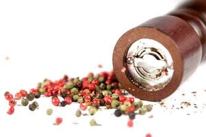 a close up of a pile of red and green peppers photo