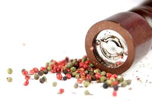 a close up of a pile of red and green peppers photo