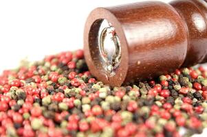 a close up of a pile of red and green peppers photo