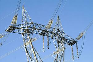 a large electrical tower with wires and wires photo