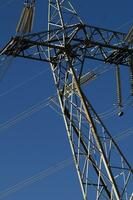 a large electrical tower with wires and wires photo