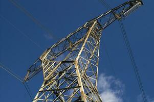 a large electrical tower with wires and wires photo