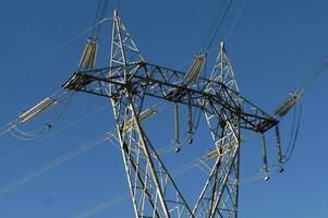 a large electrical tower with wires and wires photo