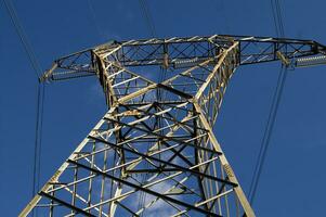 a large electrical tower with wires and wires photo