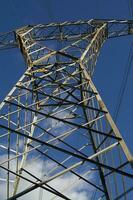 a large electrical tower with wires and wires photo