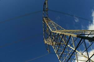 a large electrical tower with wires and wires photo