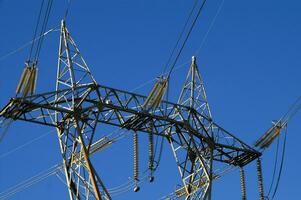 a large electrical tower with wires and wires photo