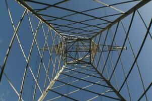 a large electrical tower with wires and wires photo