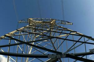 a large electrical tower with wires and wires photo